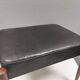 Footstool with teak wood legs and black skai (imitation leather) 1970s