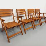 Vintage garden furniture set consisting of a table with extensions and 4 armchairs