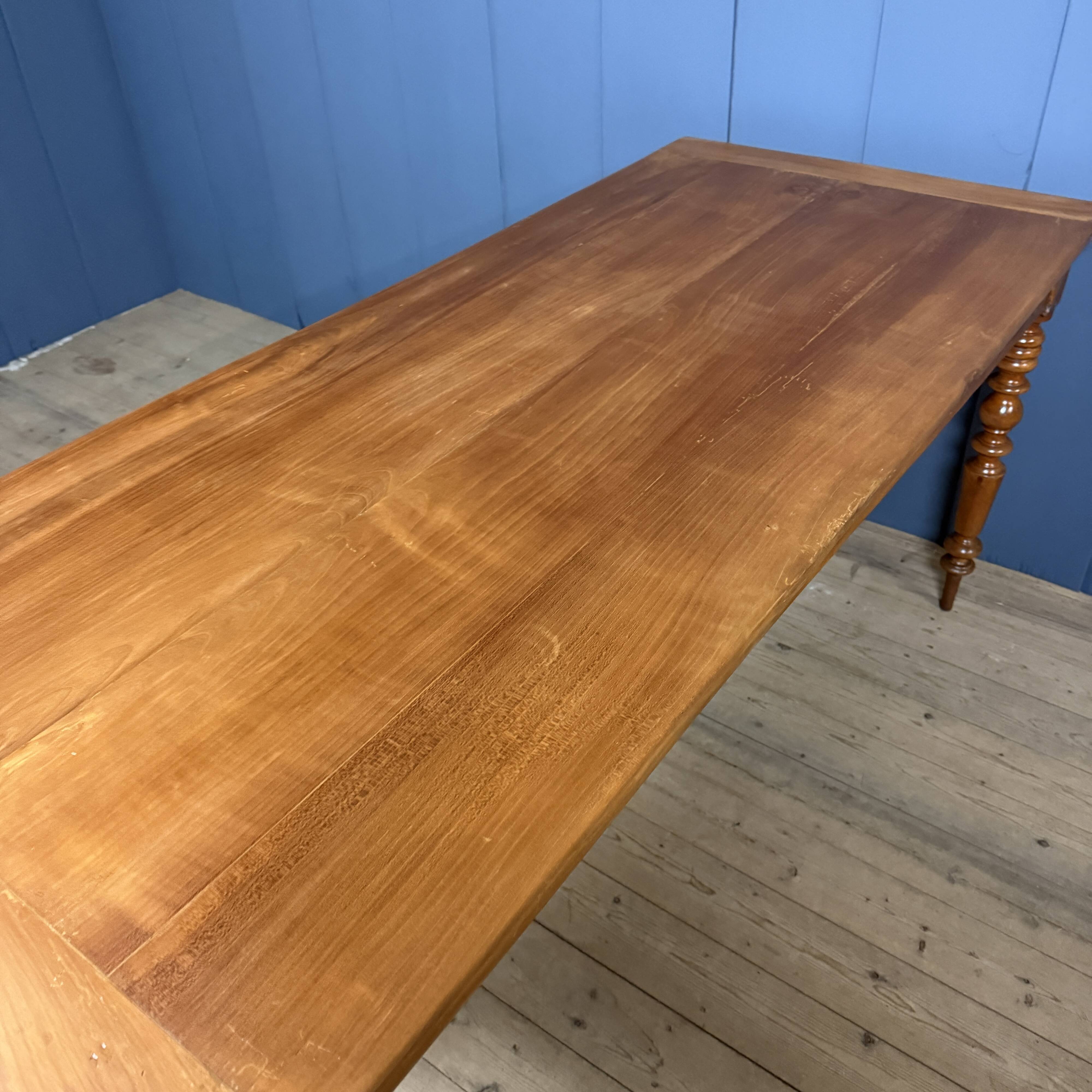 Antique cherry wood dining table from France.