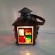 Copper lantern table lamp and 60s multicolored glasses