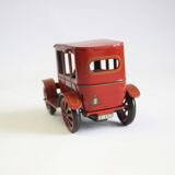 Vintage tin car with pull lever