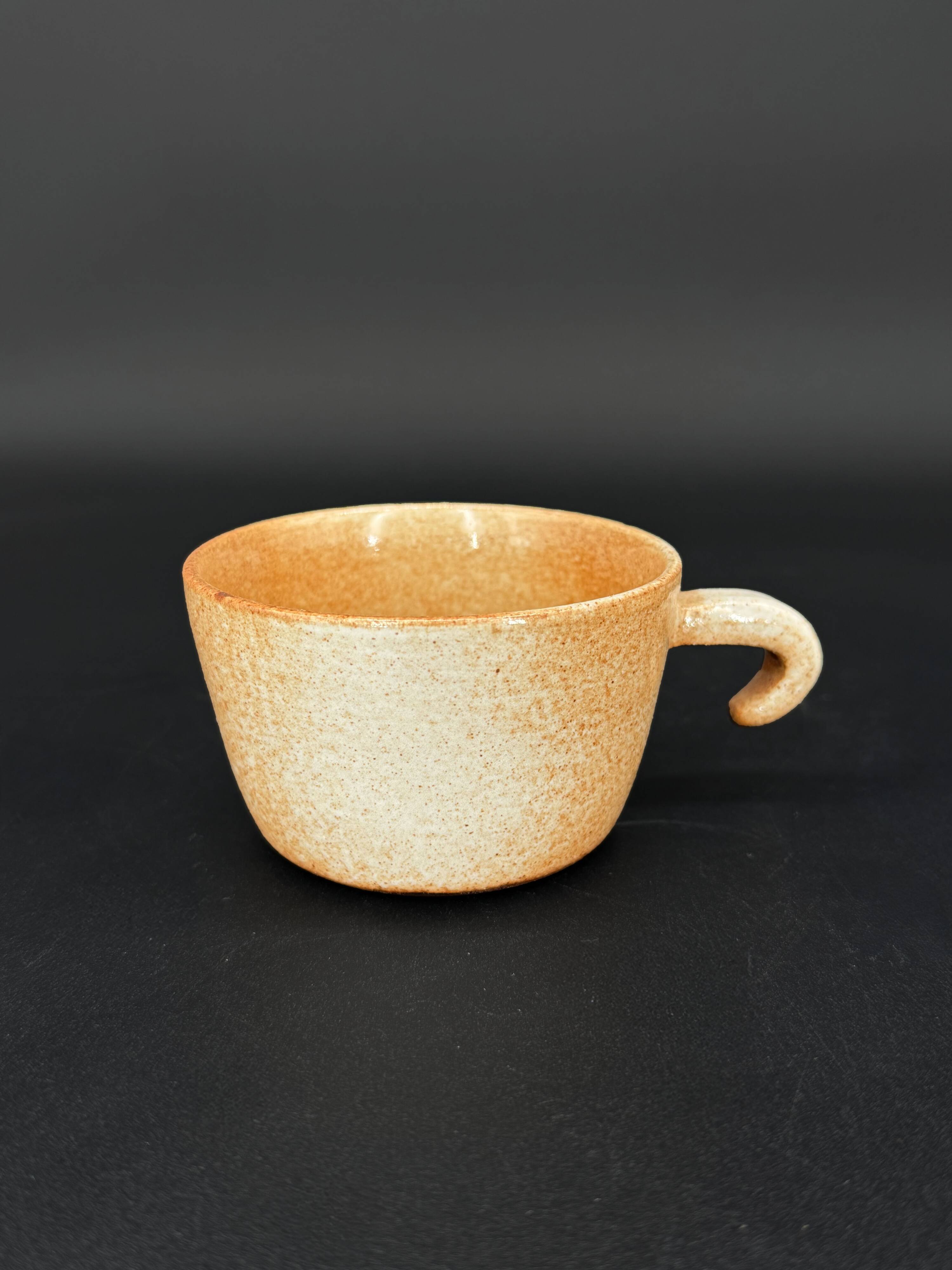 4 cups in glazed stoneware with graphic handles