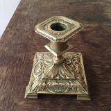 Old brass candle holder with square base