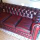 Burgundy Chesterfield-style sofa