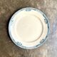 Longchamp round dish in iron earth, "Lily" service