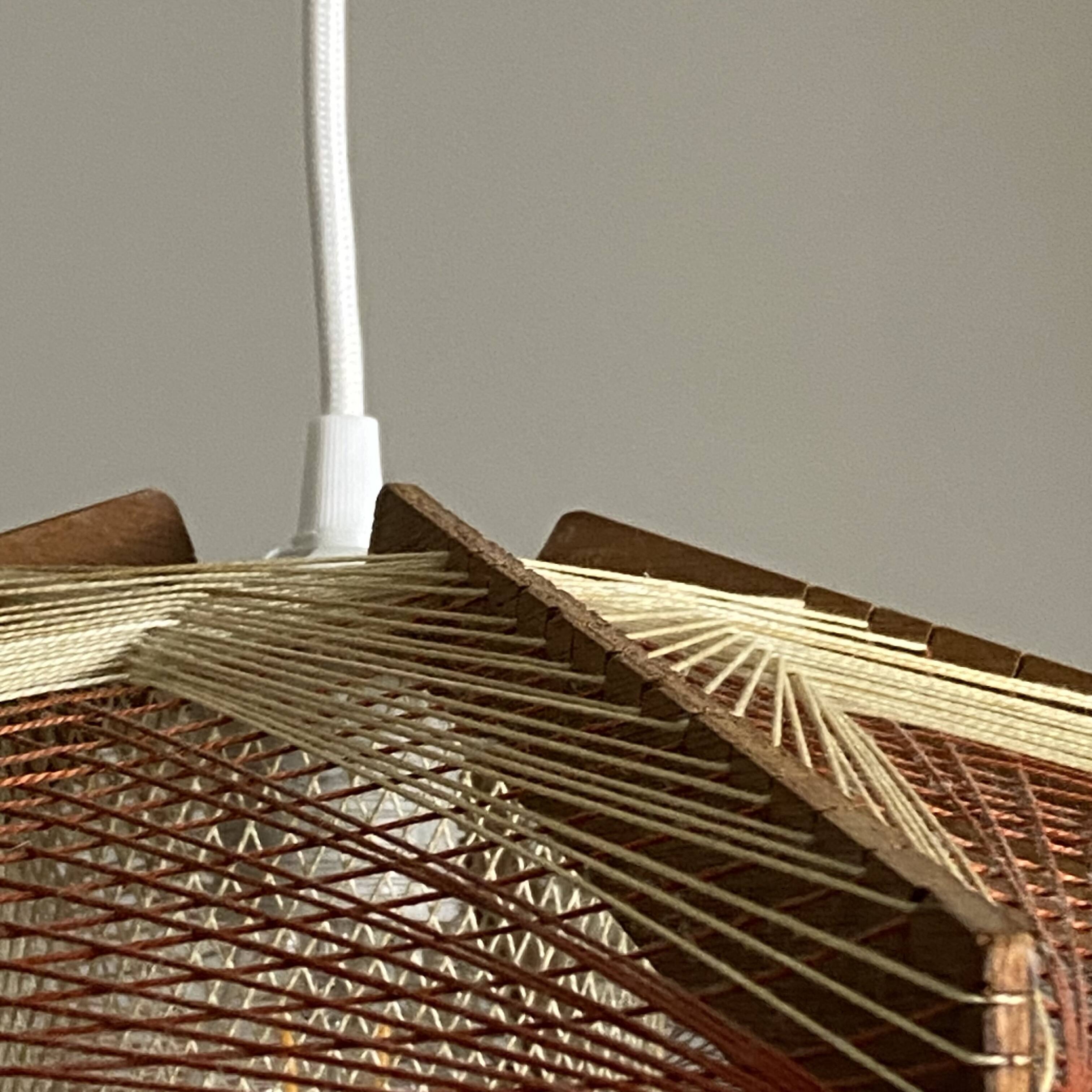 Vintage Scandinavian pendant light with stretched wires.