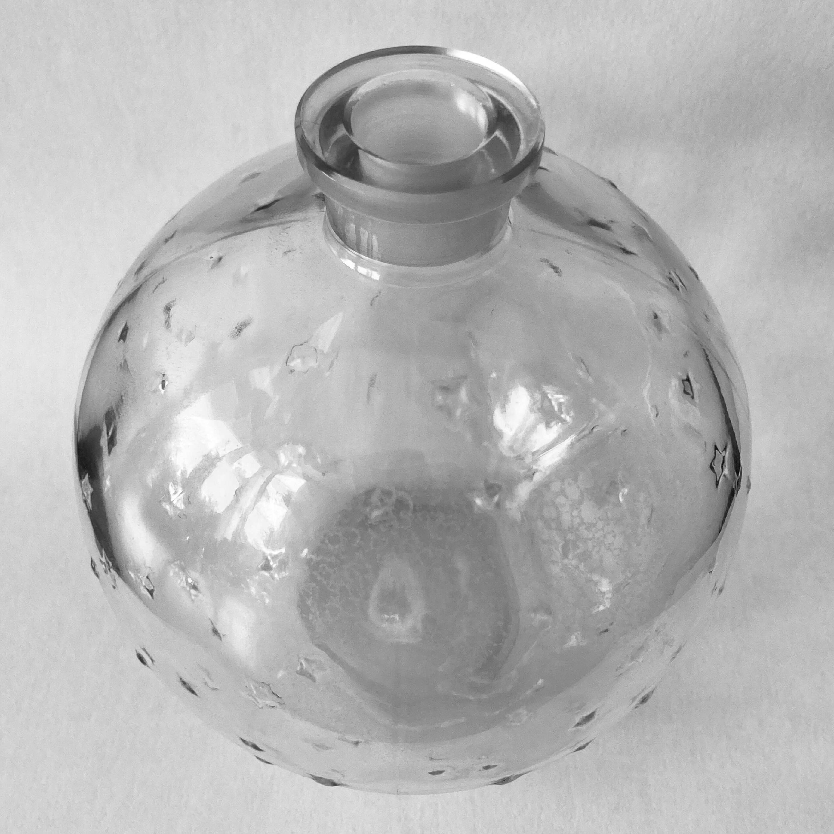 Lalique soliflore ball vase in colorless molded glass with light relief decoration of a seedling of stars