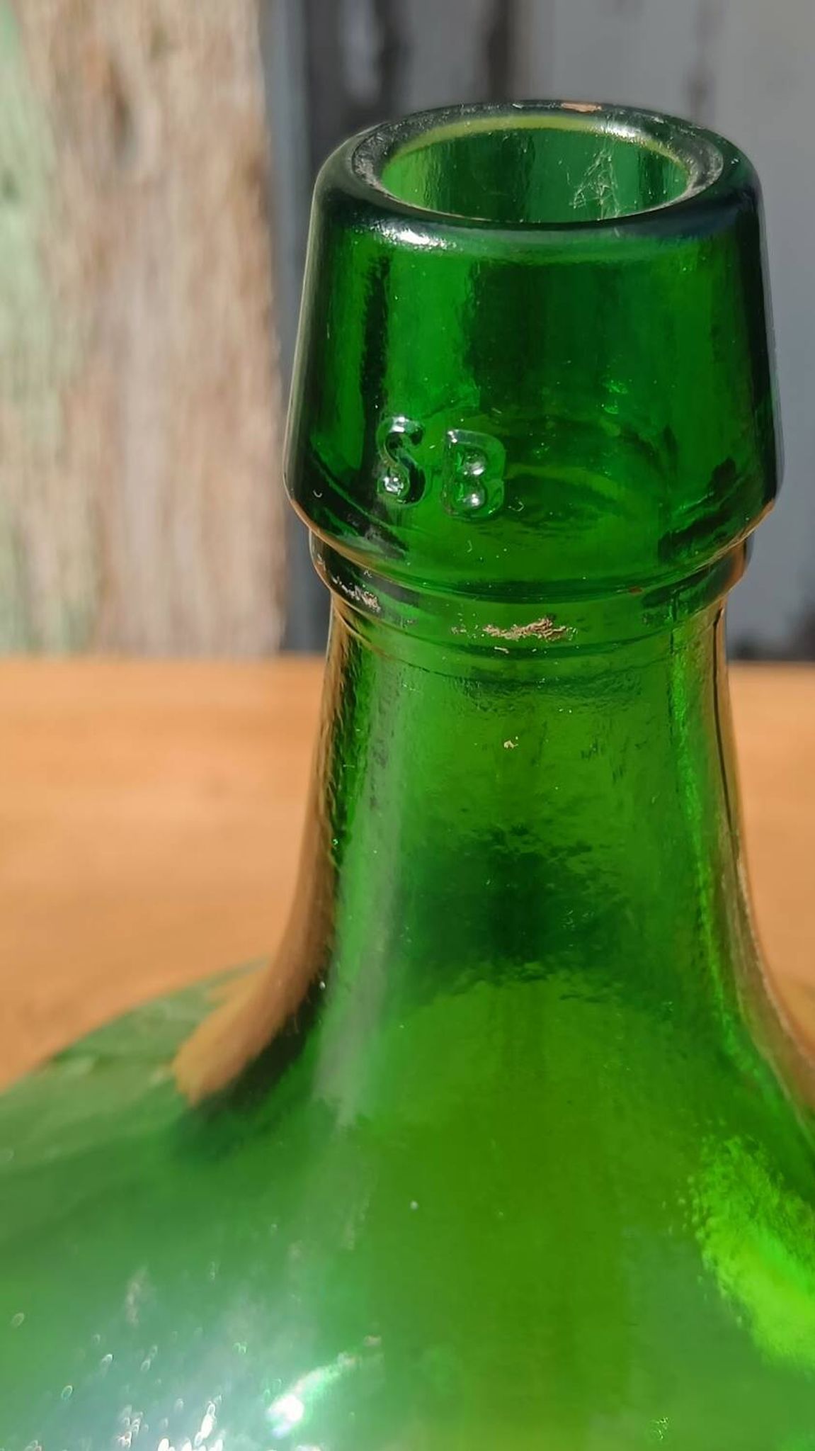 Superb antique green glass demijohn.