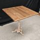 Bistro table with cast iron base and solid teak top