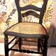 Pair of 2 chairs with cane seats in black wood, circa 1940
