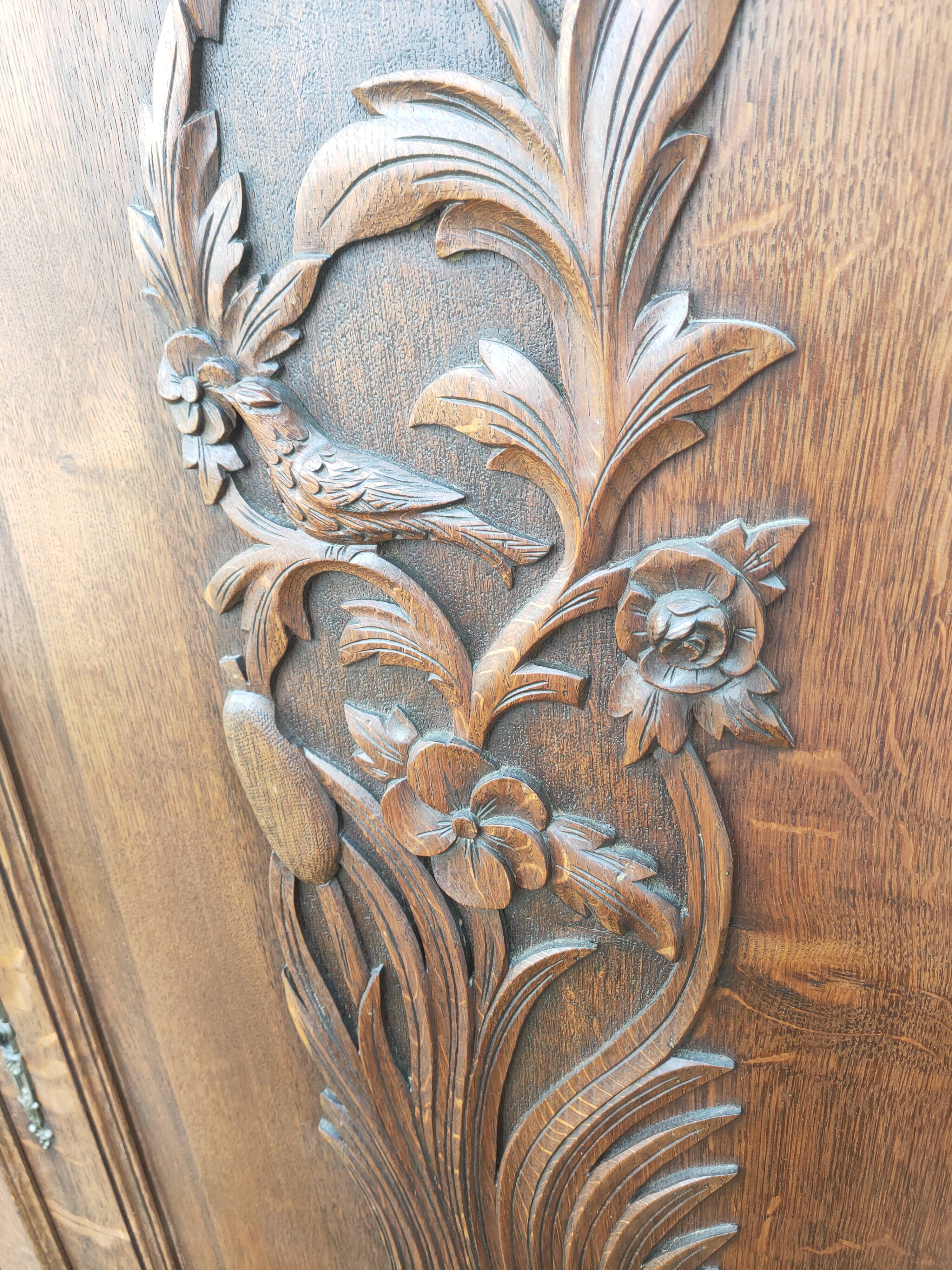 pair of antique solid oak cabinet doors with bird decor