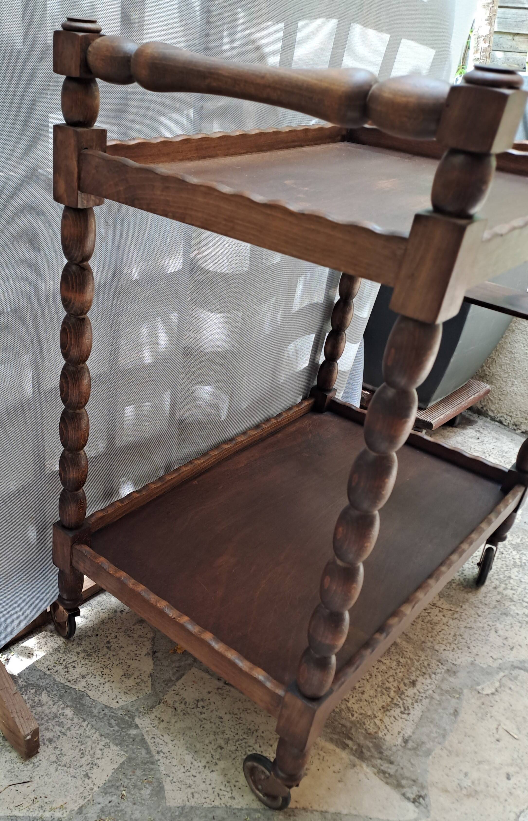 Dessert, table with wheels, side table in solid wood stained brown color France 1960