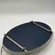 Oval chrome and mirror plateau, mid-century reflective piece.