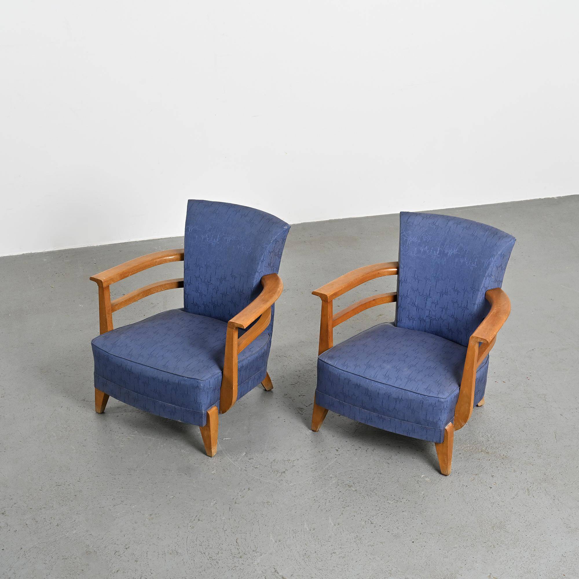 Pair of living room armchairs in solid beech, France, circa 1950.