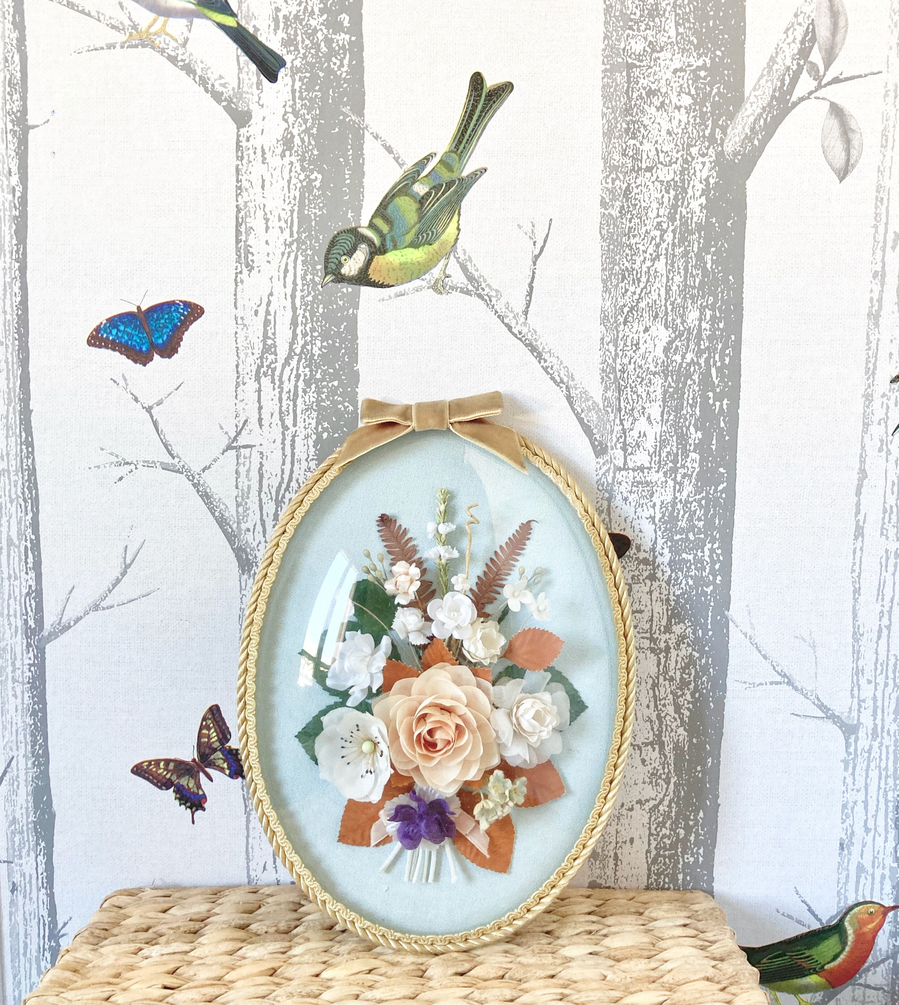 Frame domed glass flowers in fabric