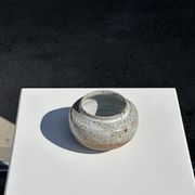 Small white ball vase tight neck in glazed speckled ceramic