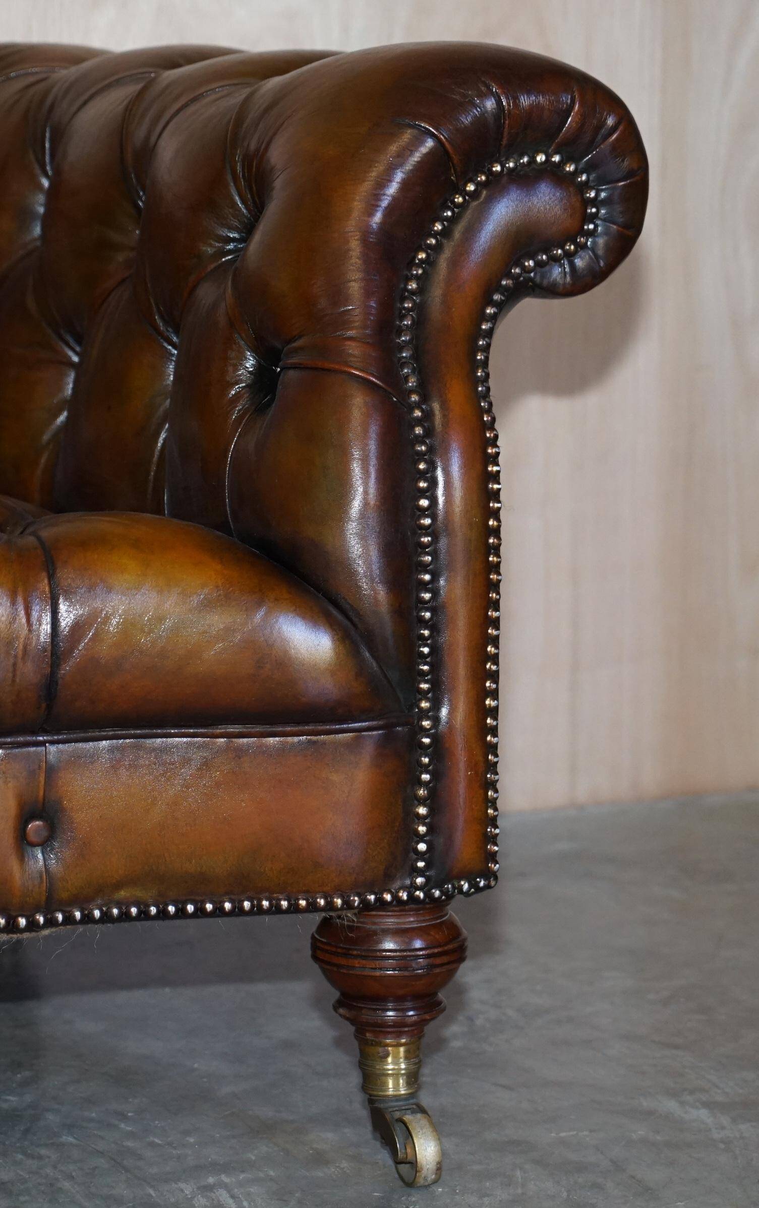 Pair of leather Chesterfield sofas by Howard & Sons