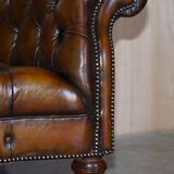 Pair of leather Chesterfield sofas by Howard & Sons
