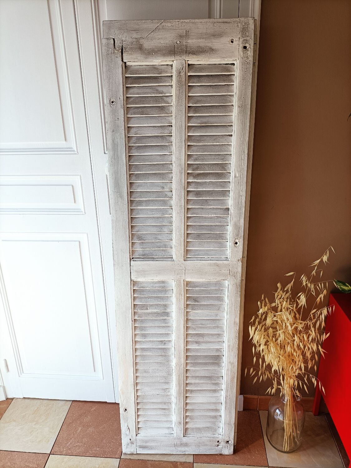 Vintage shutter renovated into a coat rack