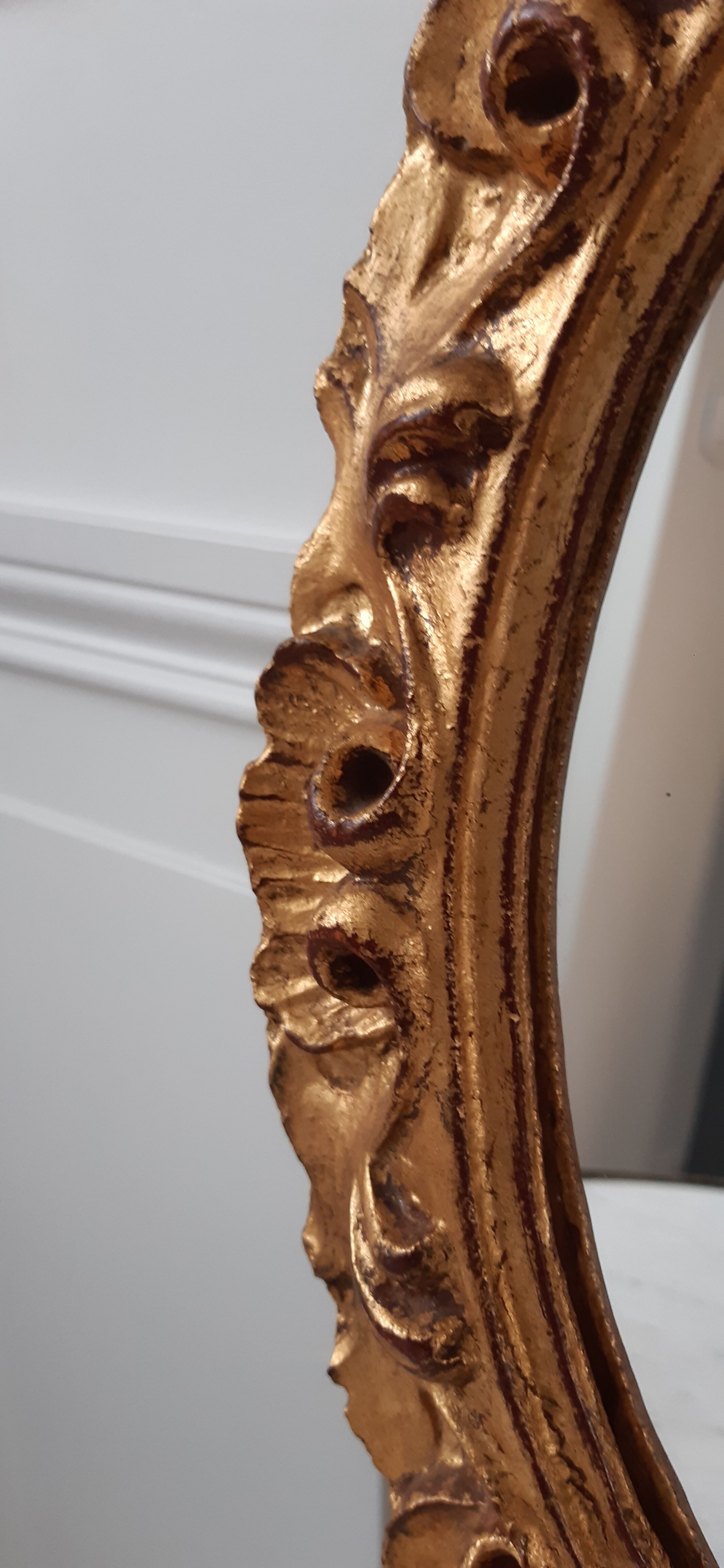 Old mirror in gilded wood late nineteenth