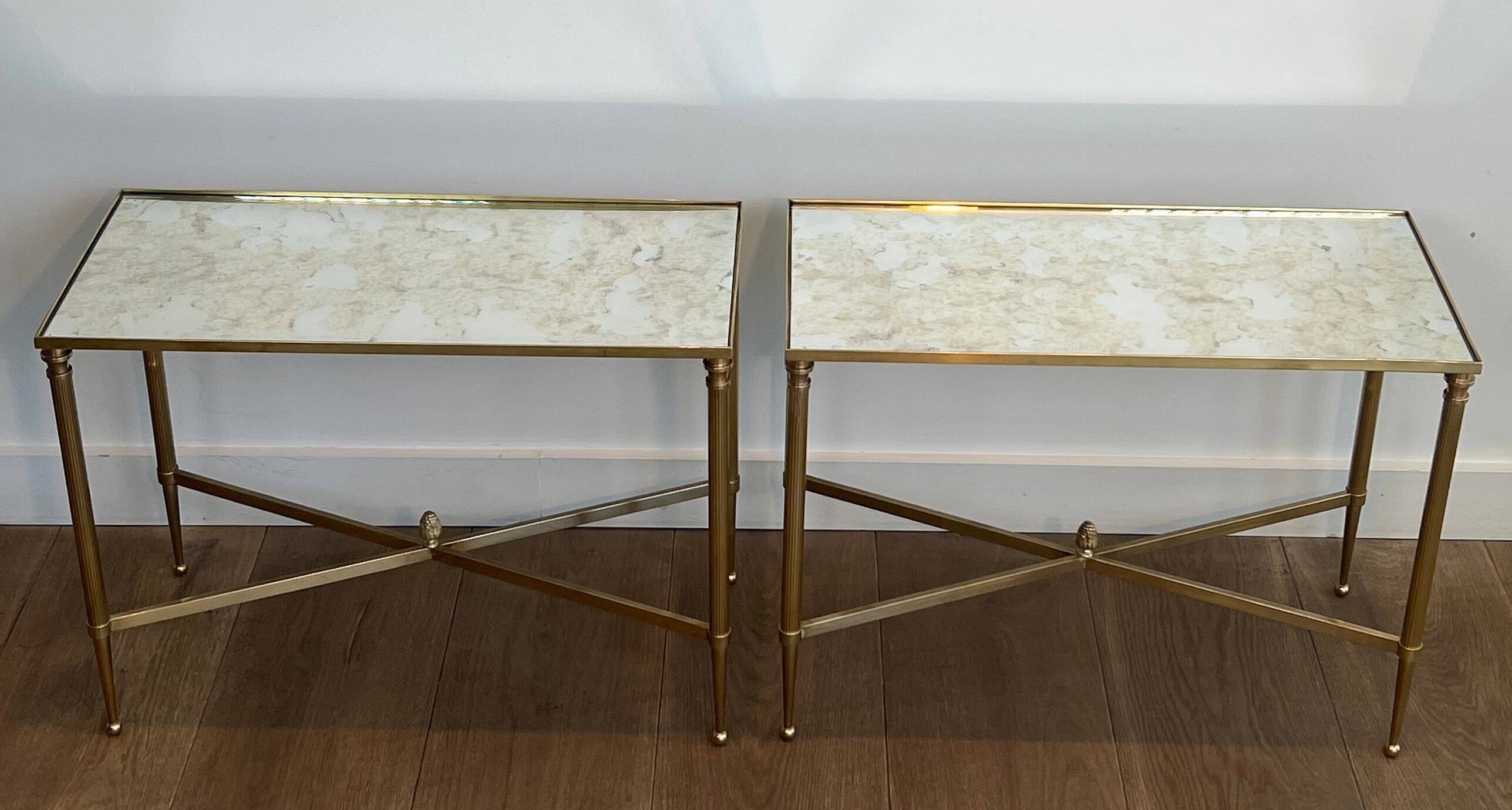 Pair of brass side tables with antique mirrored tops from Maison Jansen