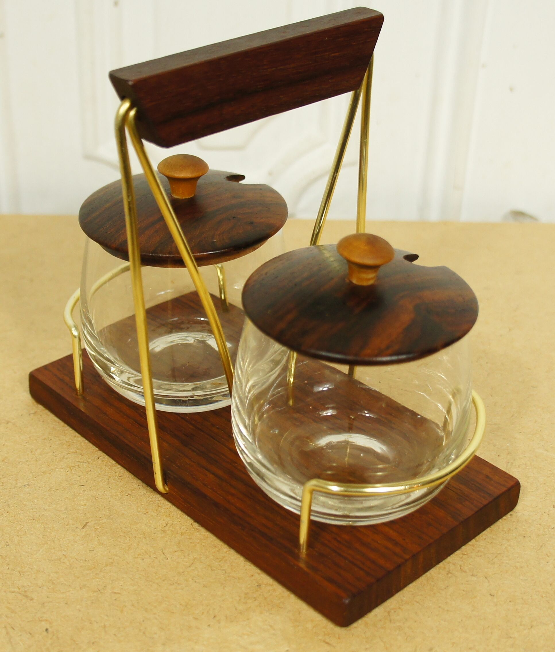 Scandinavian condiment servant made of olive wood