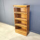 Four tier oak barrister style bookcase with leaded glass