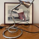 Chrome table lamp with spiral base and adjustable head. Halo brand