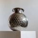 Vintage Italian vase in nickel-plated brass from the 1960s, hand-hammered relief of fruits and leaves.