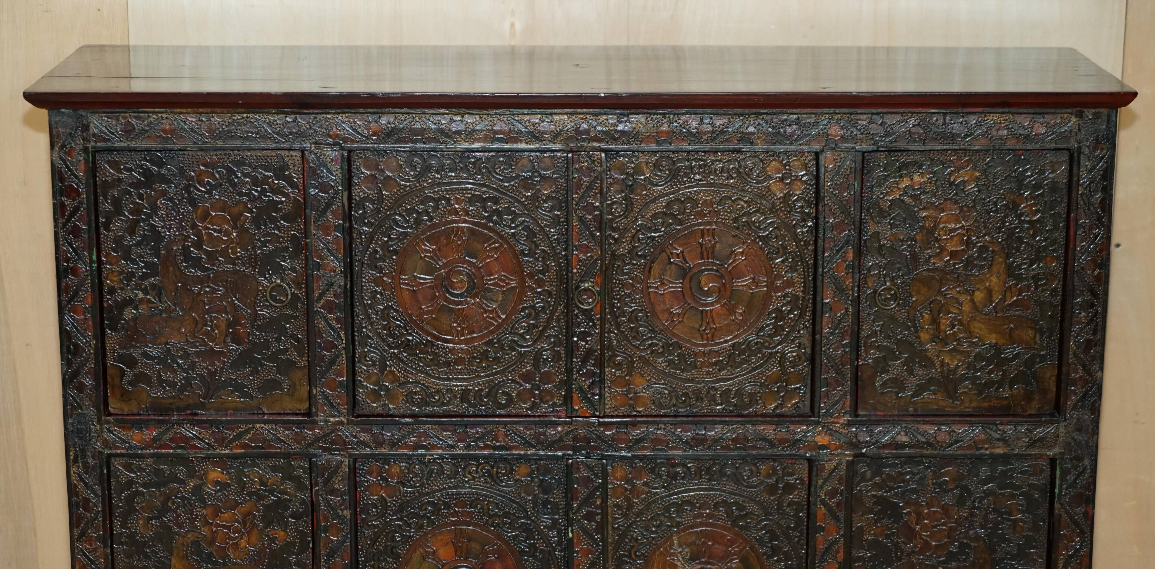 Antique polychrome Tibetan altar cabinet with deer and flowers.