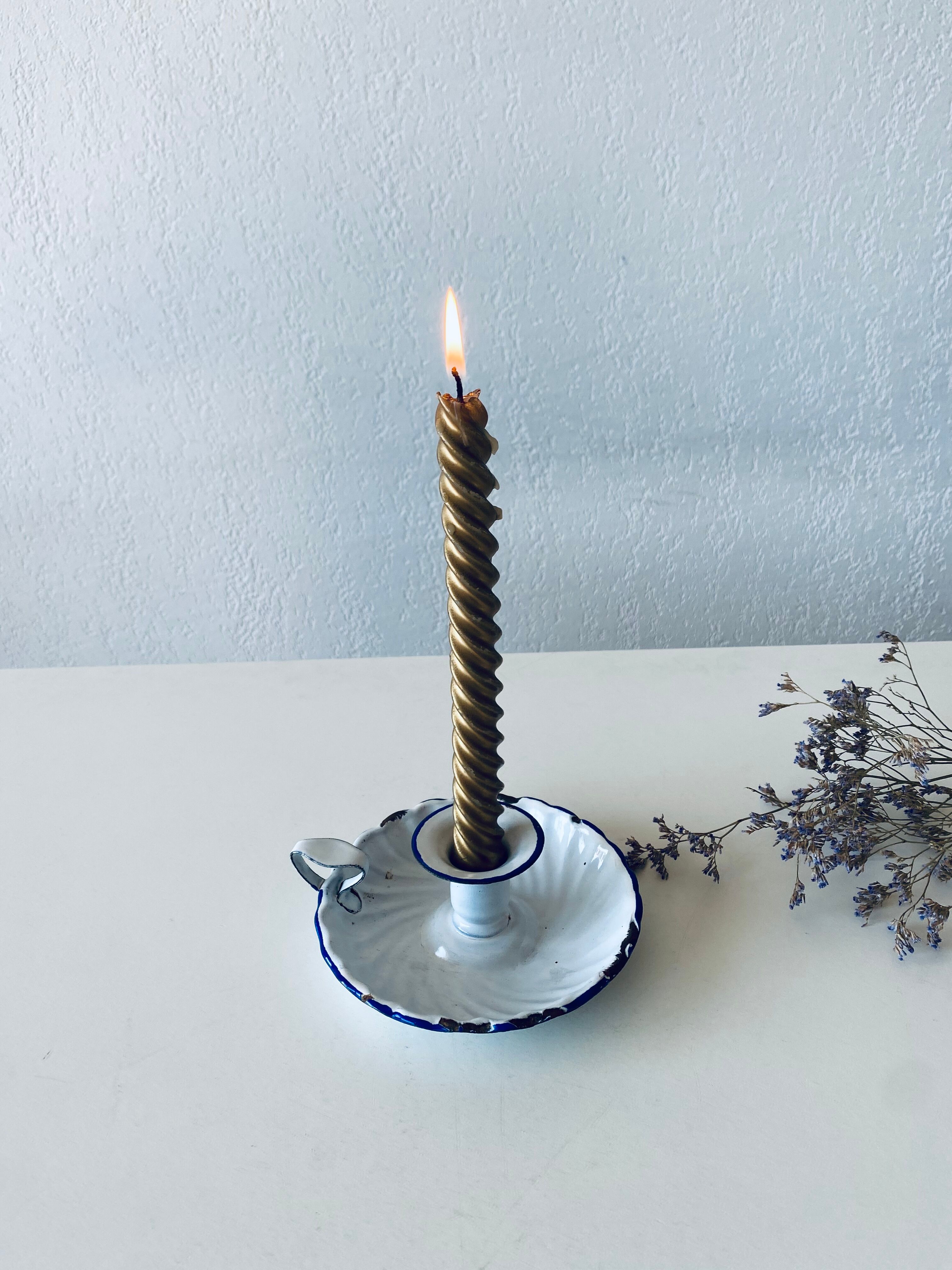 Antique candle holder in white and blue enamelled metal
