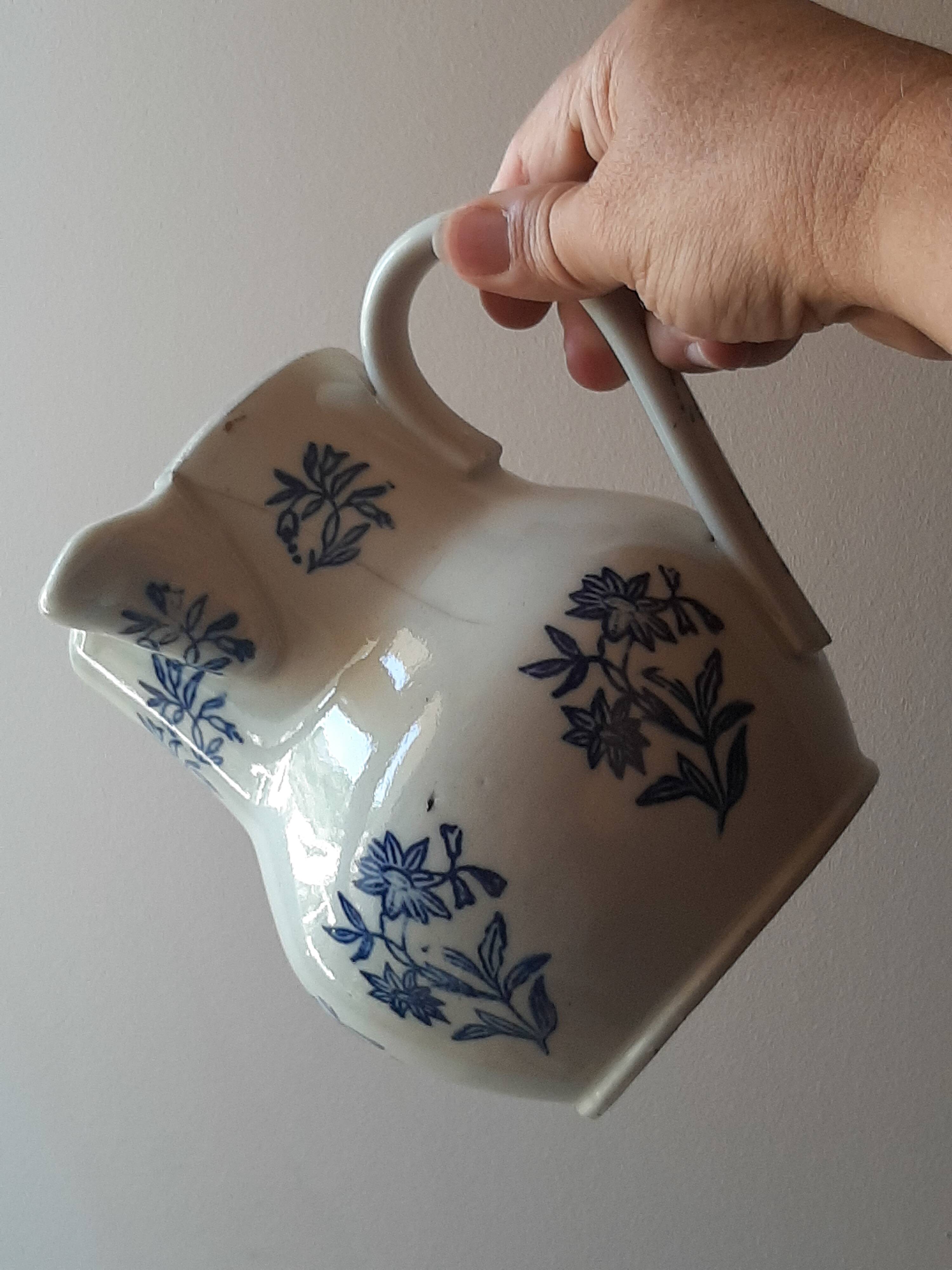 Large antique cruet in Saint Uze earthenware with blue flowers.