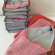 Tablecloth and 12 coral and grey napkins in a retro Scandinavian 1960s style.