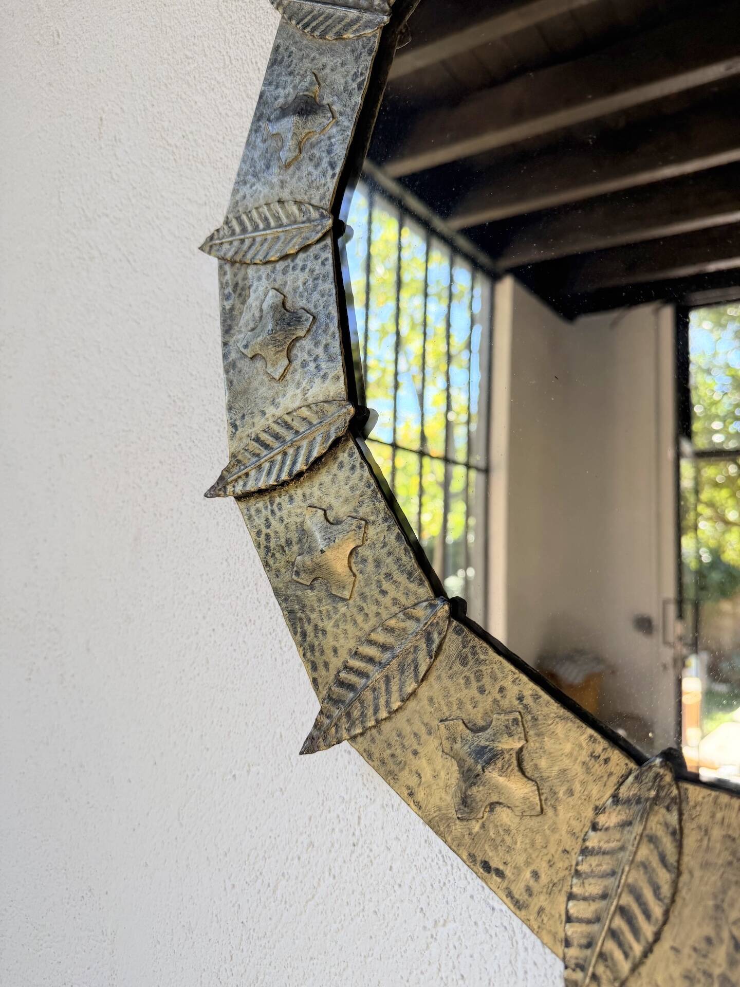 Brutalist round hammered gold metal mirror
