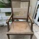 Wooden armchair with caning in Louis XVI style