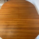 Extendable teak round table