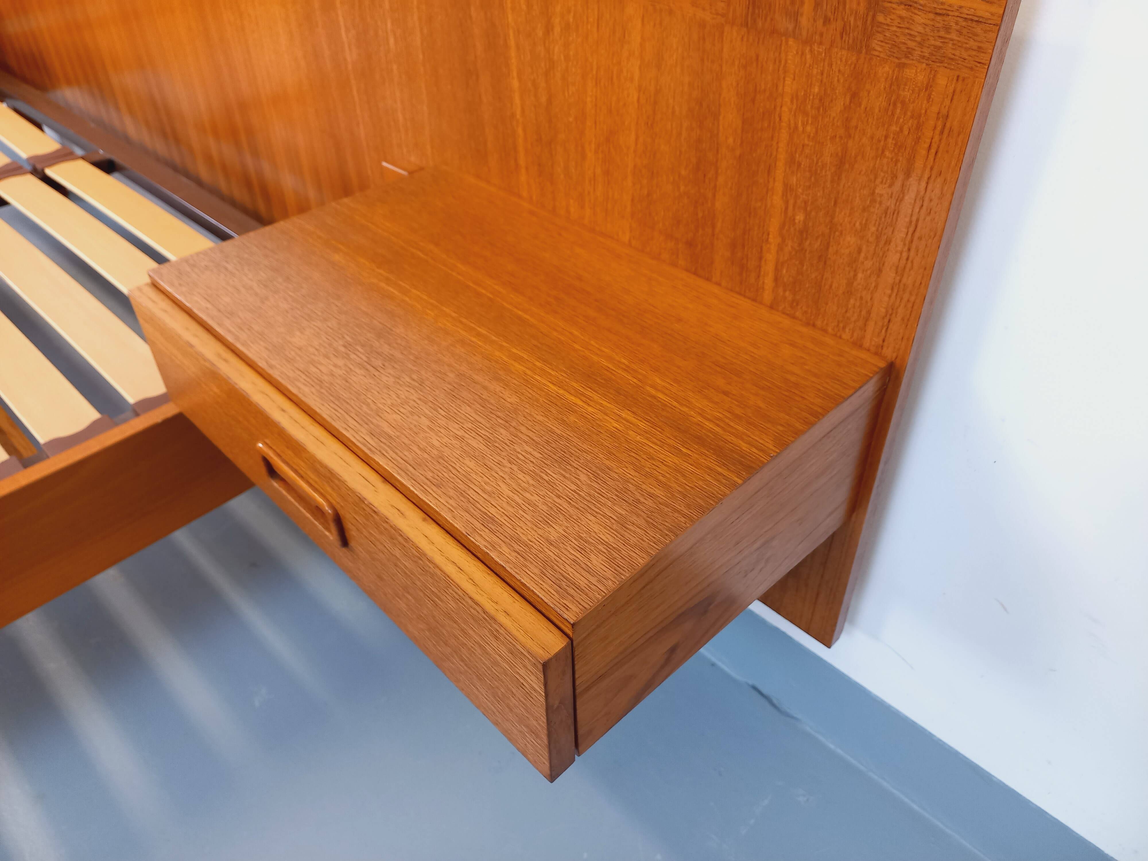Double bed vintage Scandinavian in teak from the 1960s with integrated bedside tables.