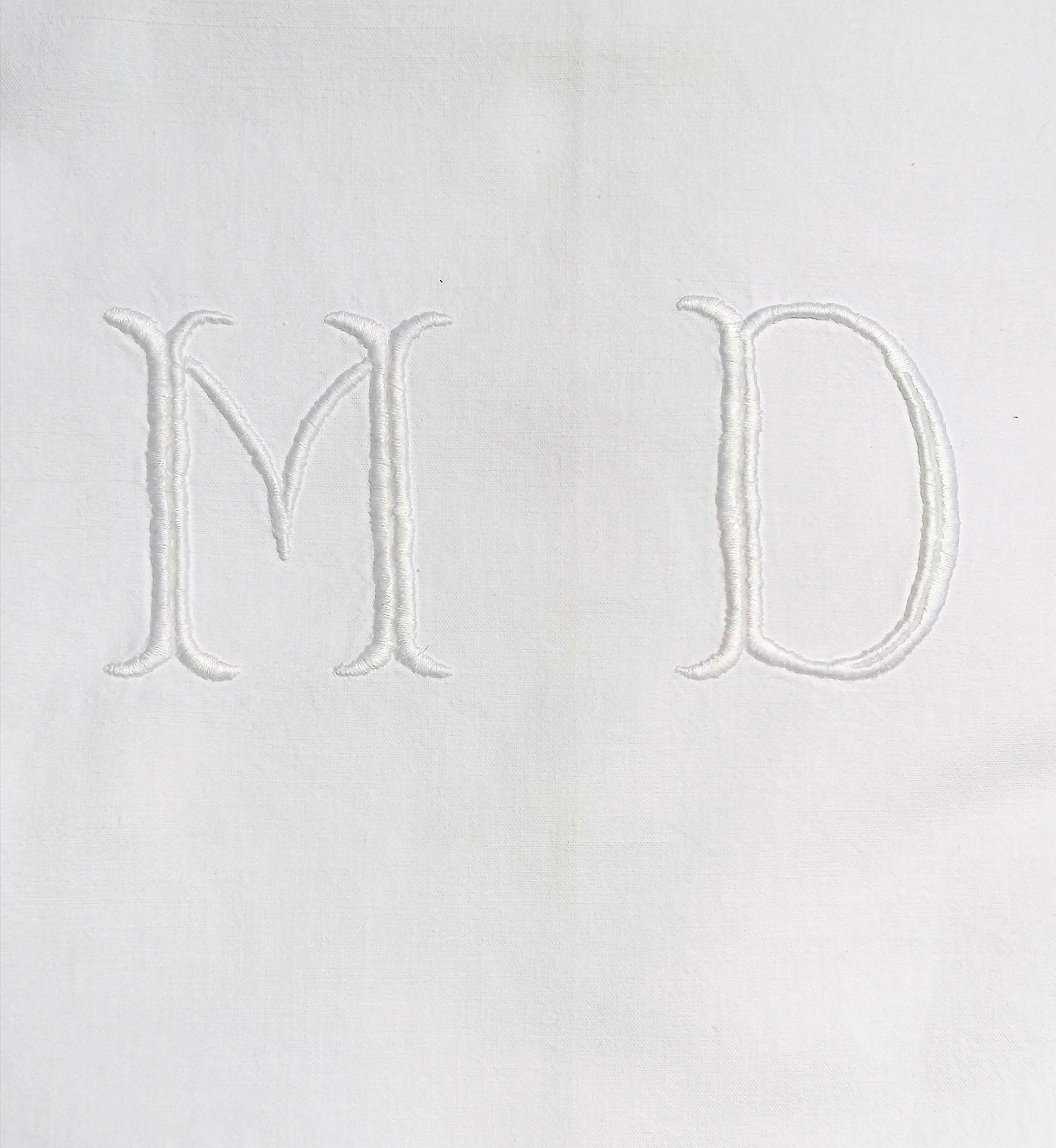 M and D monogram embroidered sheet