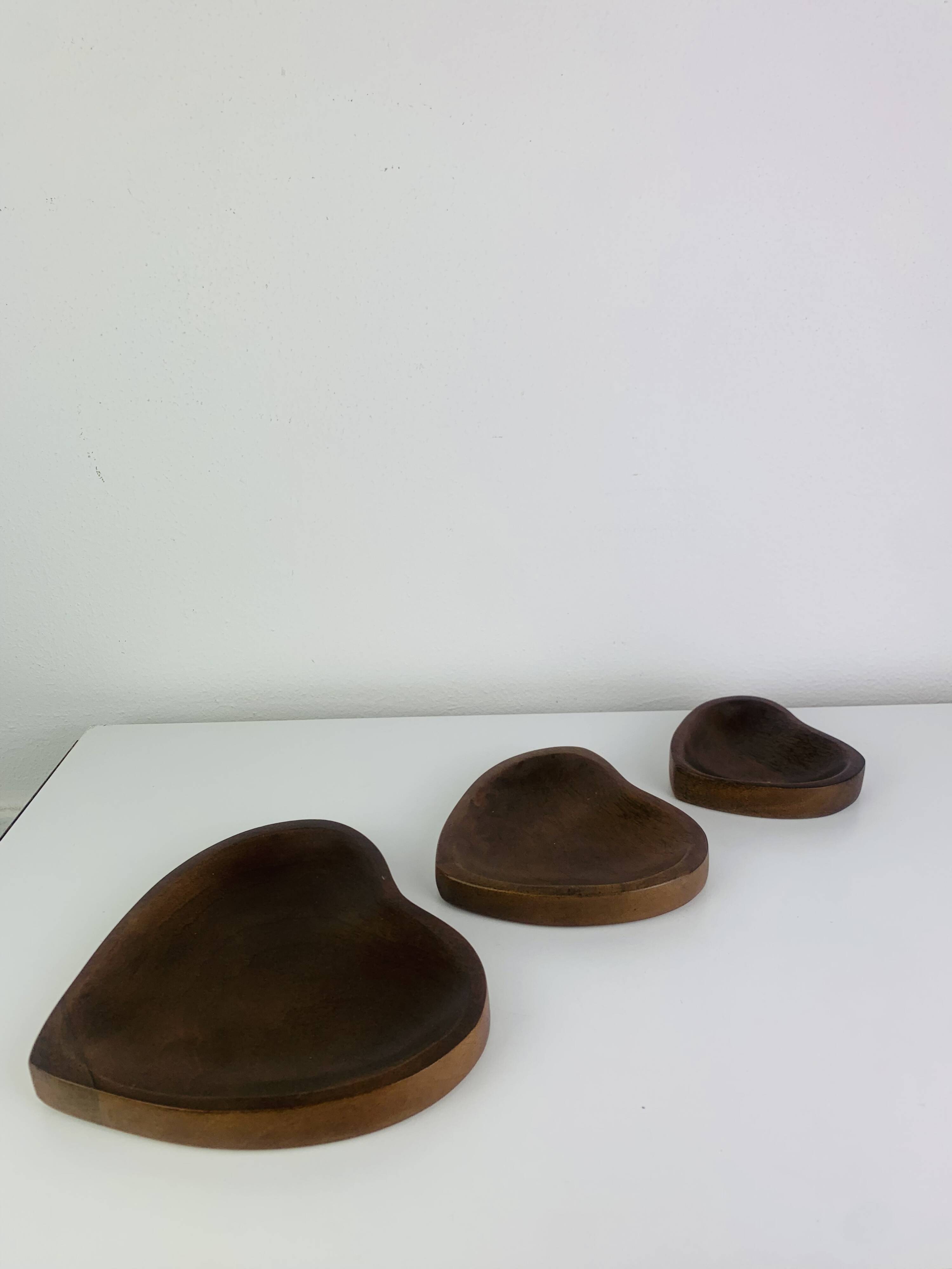 Set of 3 Scandinavian teak empty pockets in heart shape.