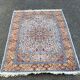 Handmade Persian rug in blue, beige, burgundy, and orange, 95x160cm.