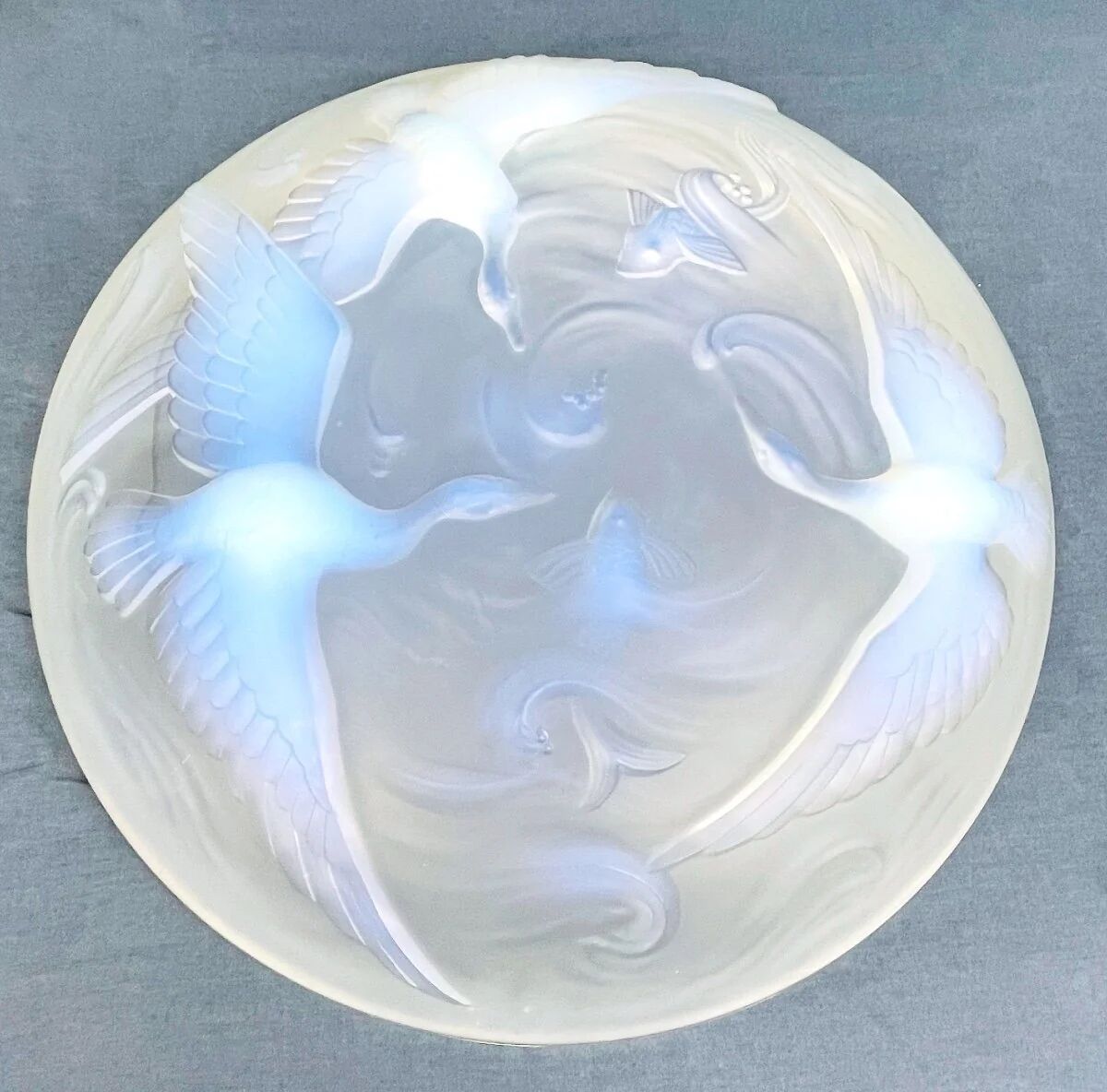 Verlys, iridescent glass cut with a design of geese and fish.