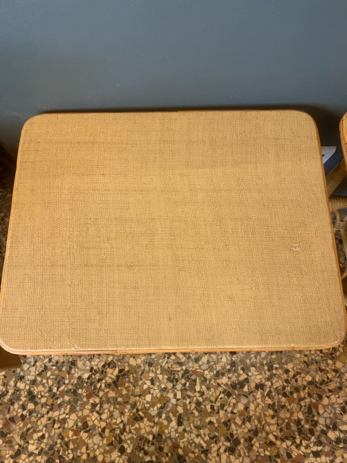 A pair of rattan bedside tables.