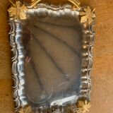 Silver metal top and decoration of foliage and handles in vintage brass