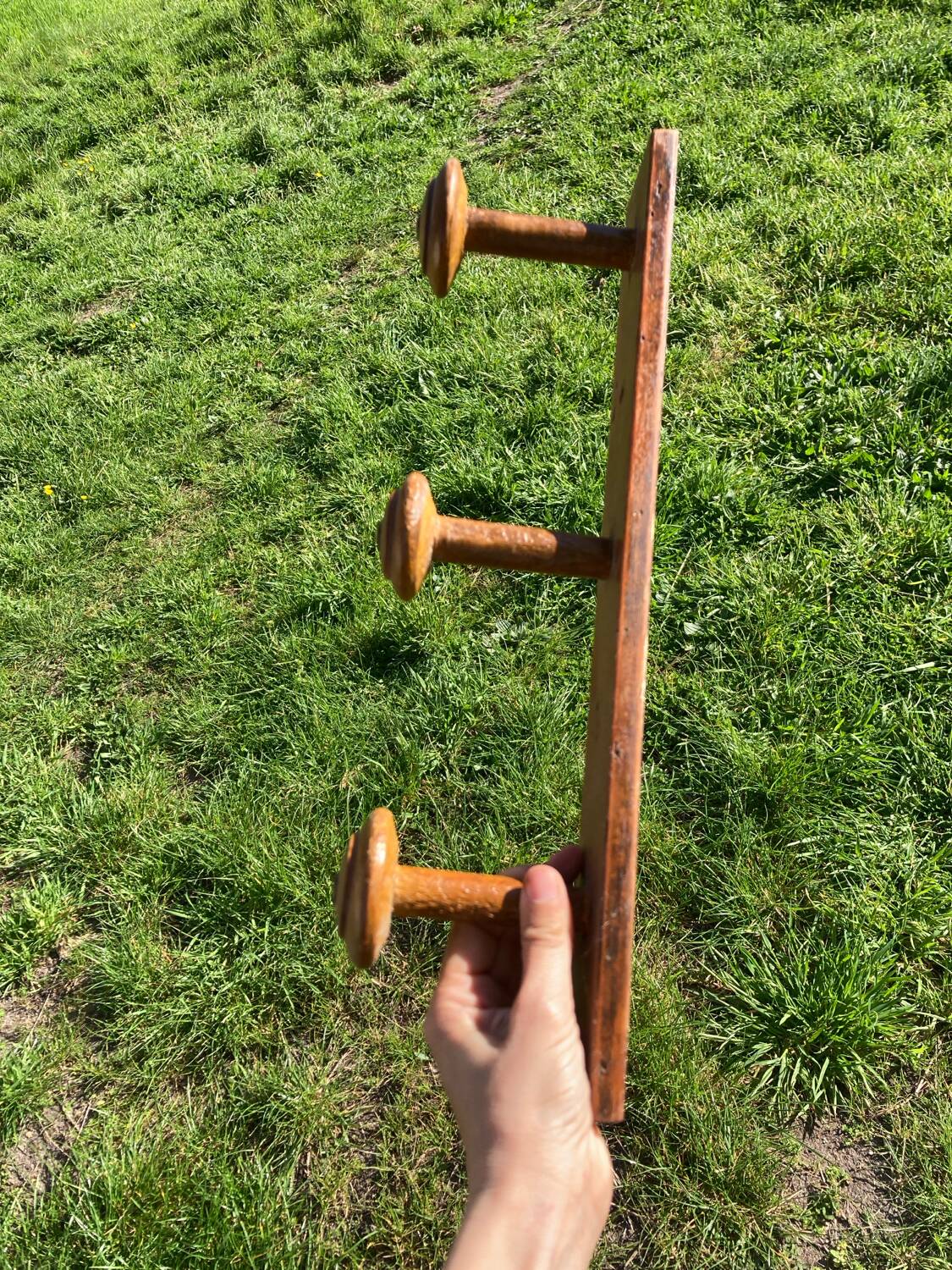 Old wooden wall coat rack
