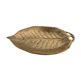 Bronze leaf-shaped pocket emptier