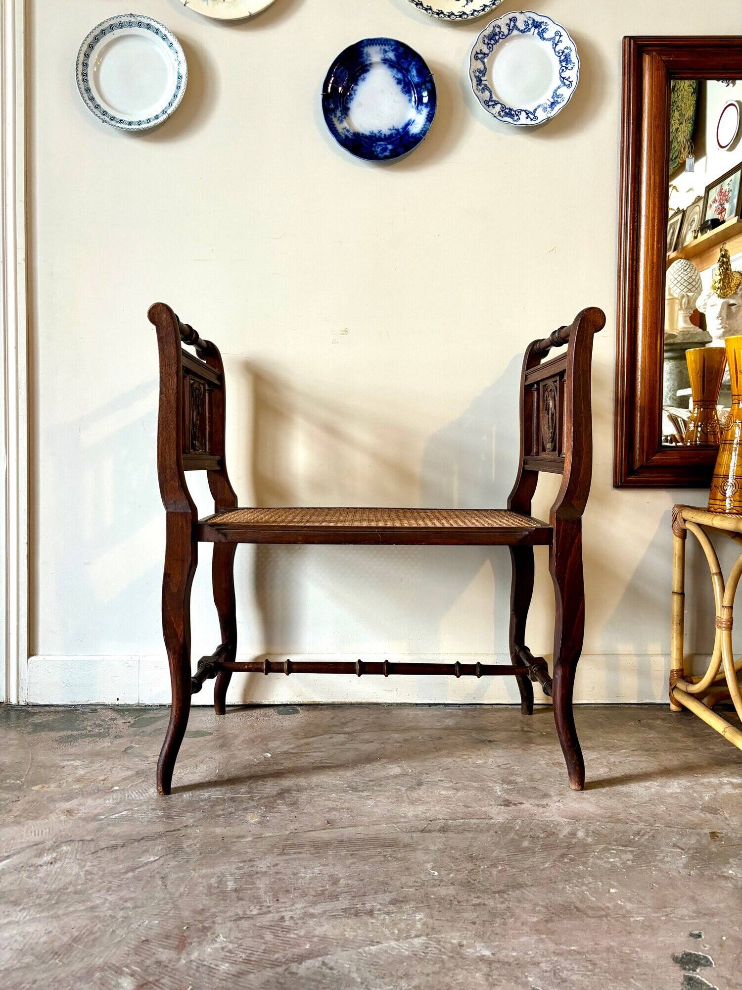 Dark wood and cane bench