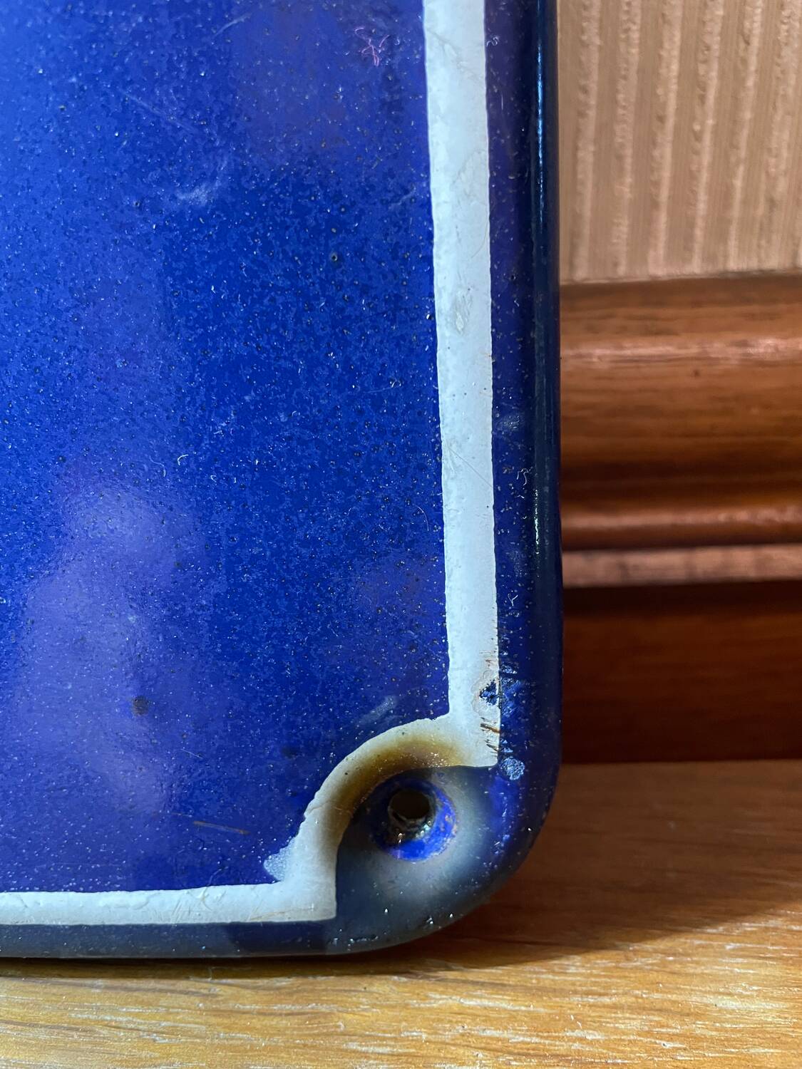 Enameled sheet metal street sign