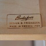 Scandinavian bookcase with storage compartment