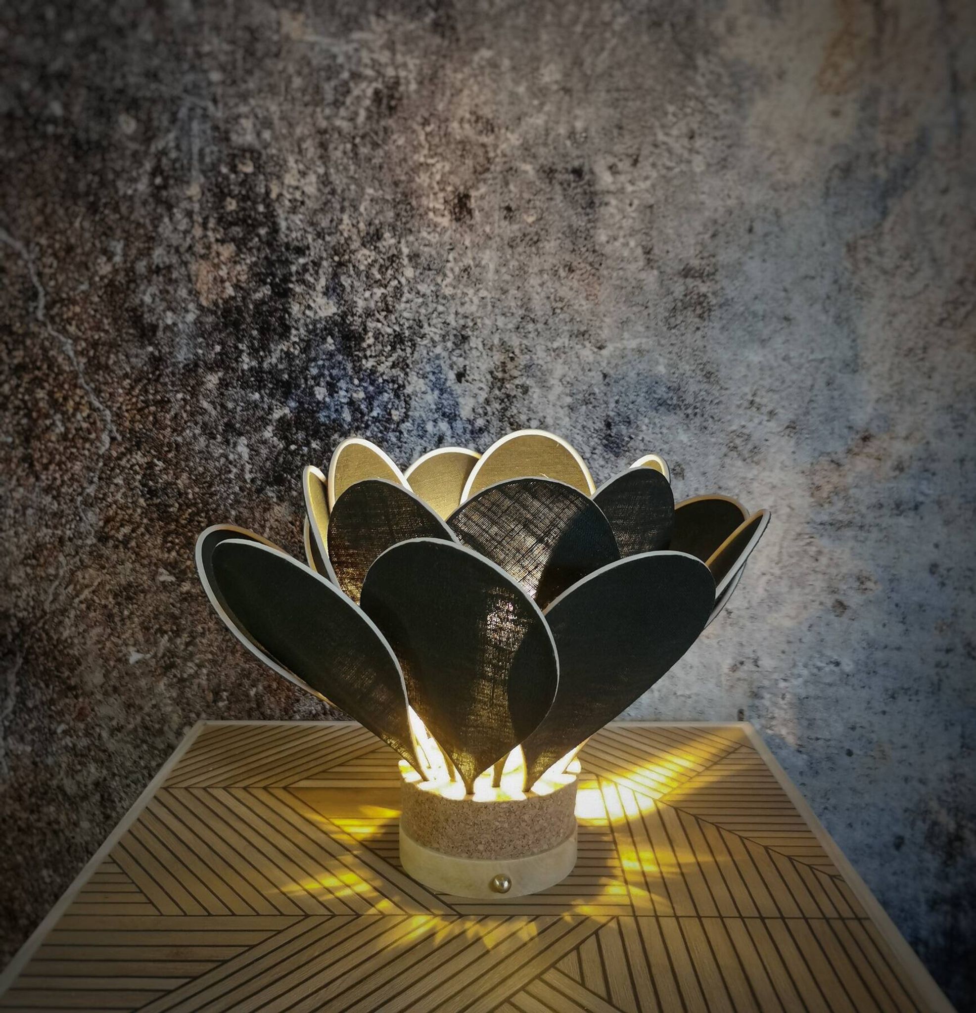 Flower table lamp made of rattan and fir green linen petals