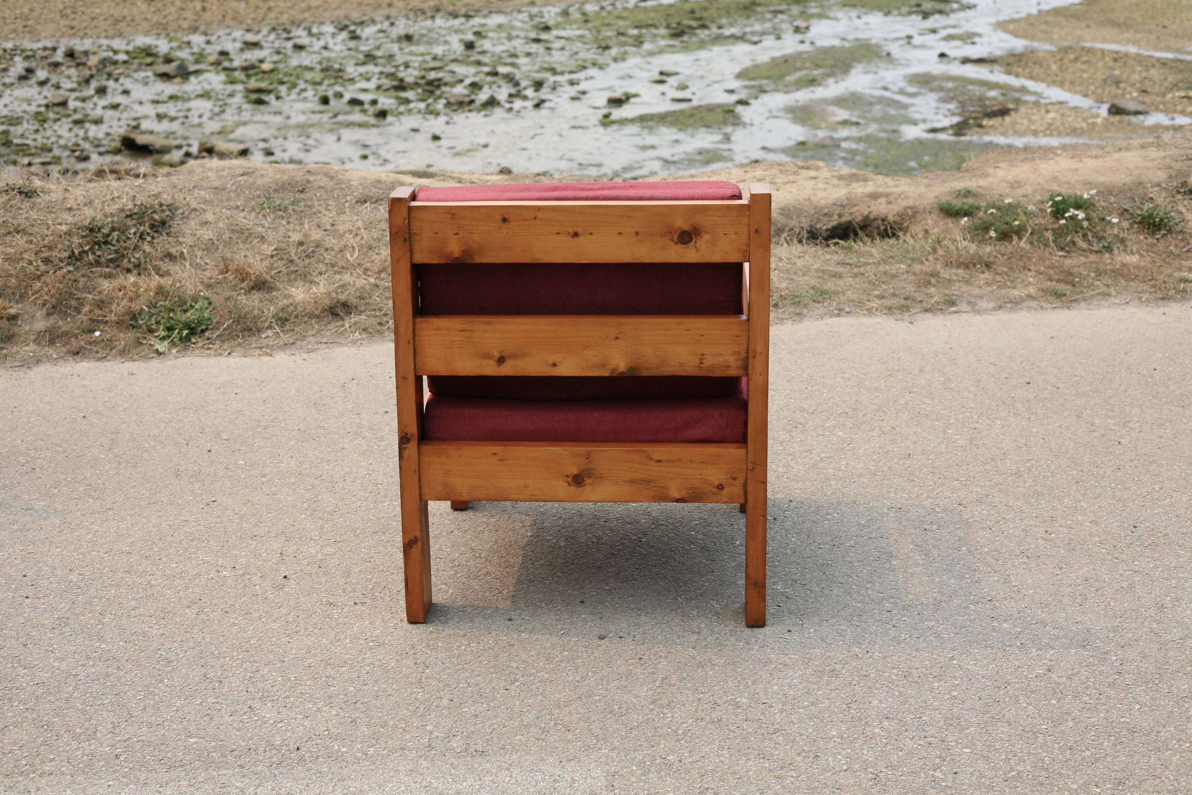 Pair of pine fireside chairs, France, 1960s, "raspberry" cushions